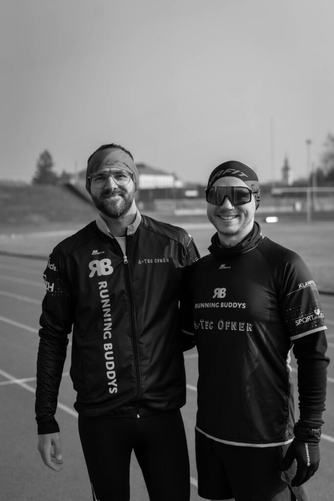two men smiling at the camera